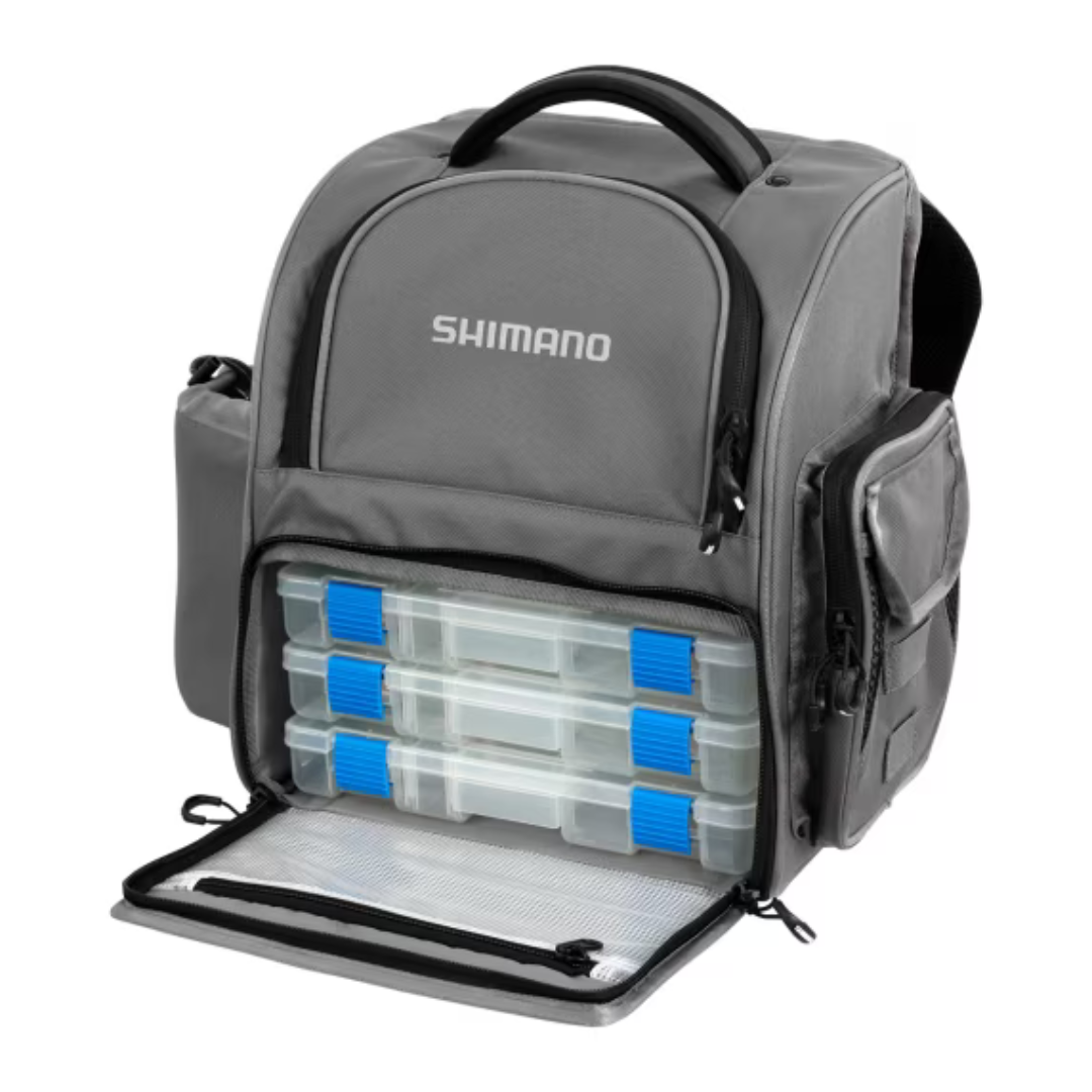 Shimano medium backpack with front compartment open, showcasing included tackle boxes for organized fishing gear storage.
