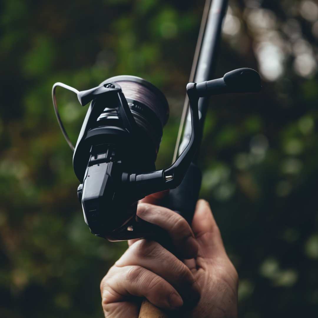 Close-up of the Shimano Aero BB C5000 reel in action, showing its smooth operation and ergonomic handle during fishing.